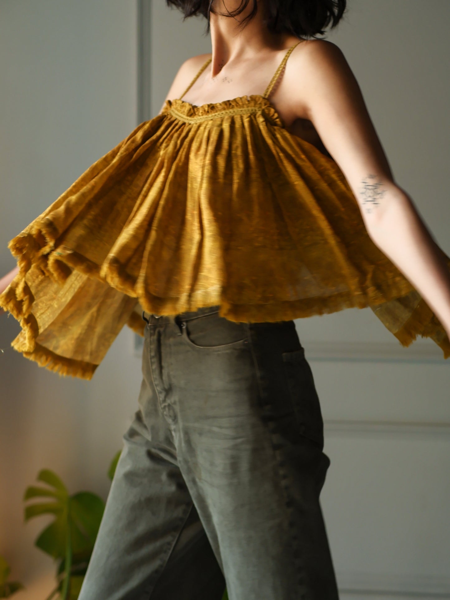 Mustard Flare sling crop top with fray edge